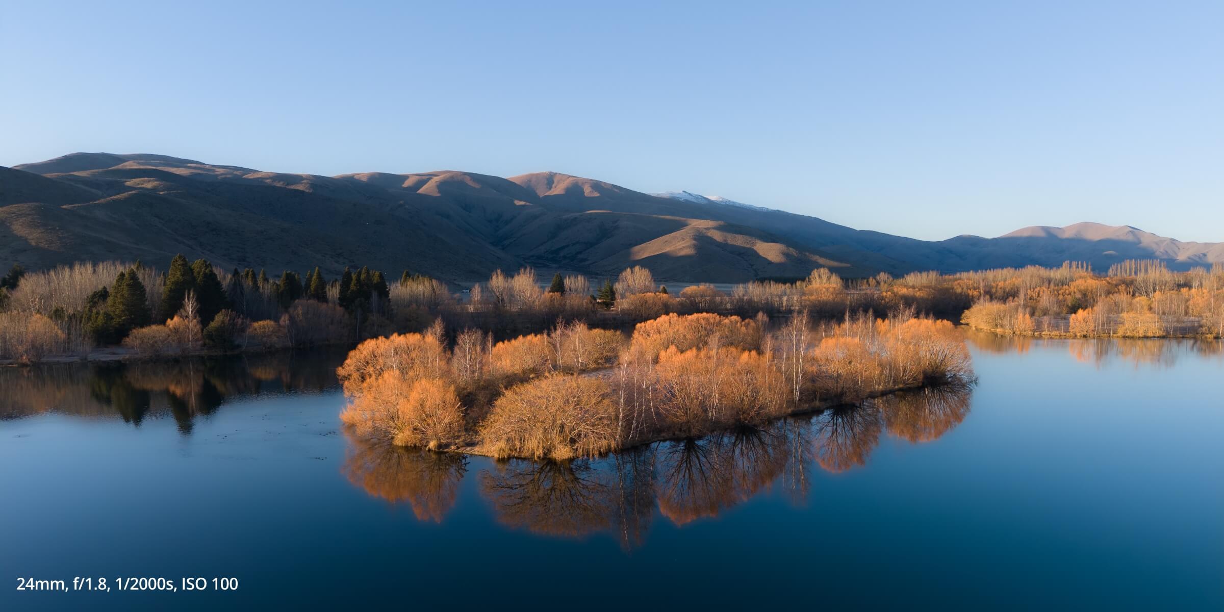 Air 3S photo taken of an island in the middle of a lake, with 24mm, f/1.8m 1/2000s, ISO 100
