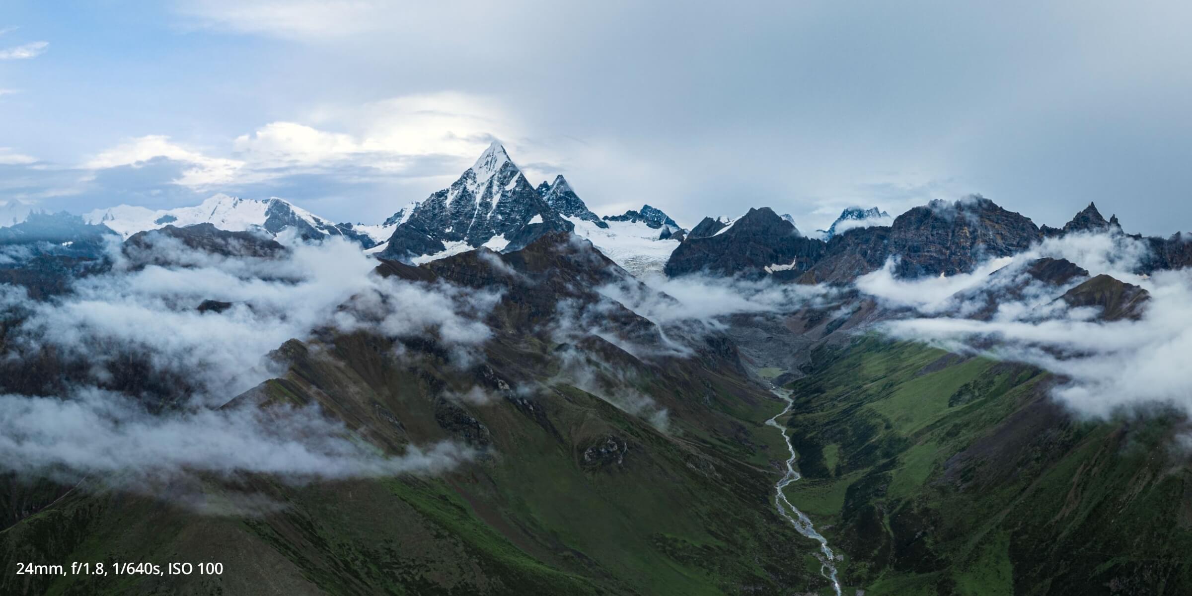 Air 3S photo taken of cloud covered mountain tops, with 24mm, f/1.8, 1/640s, ISO 100