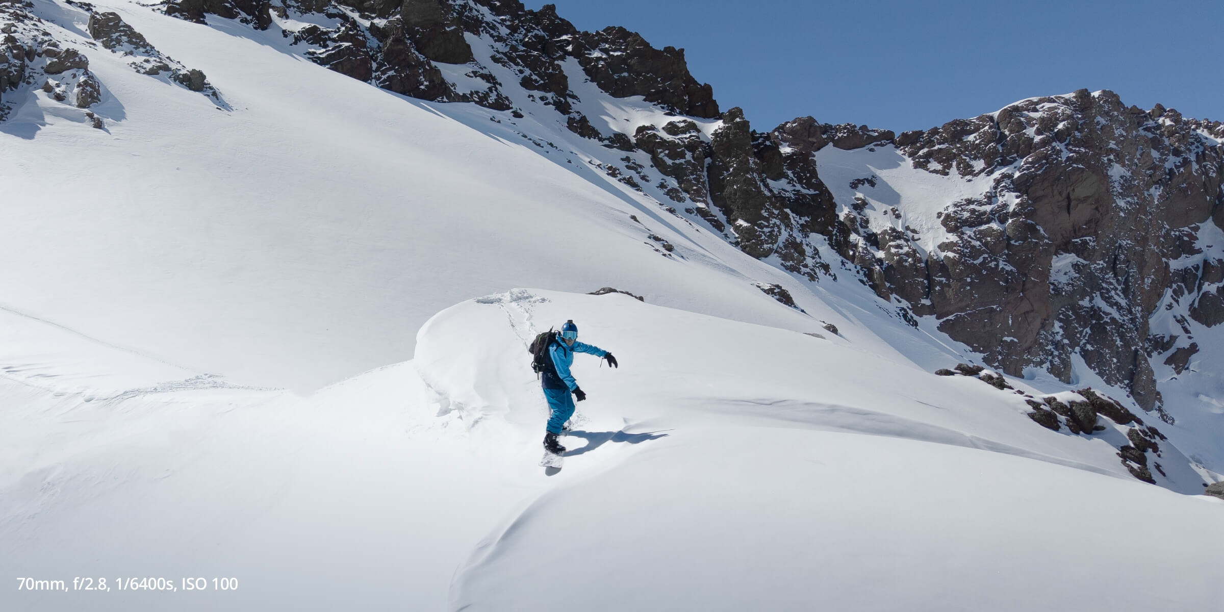 Air 3S photo of snowboarder on a snowy mountain taken with settings of: 70mm, f/2.8 1/6400s, ISO 100